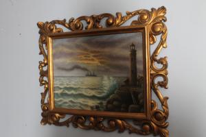 Antique painting on panel depicting a Seascape with lighthouse. 1940 signed in golden frame. Dimensions 56 x 46 cm.